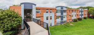 Exterior of Liberty Lake Apartments, a 3 story apartment building.